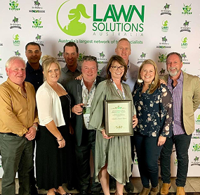 lawn solutions group with award