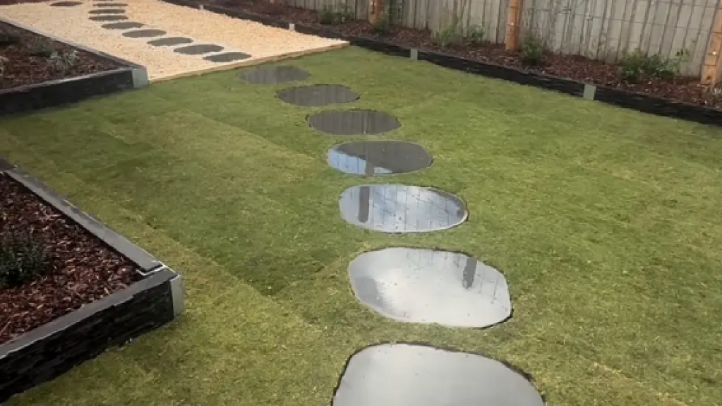 Freshly laid TifTuf Bermuda turf in a Lynbrook backyard.