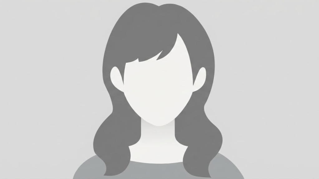 A generic grey silhouette avatar representing a woman with long wavy hair, used as a default profile placeholder.