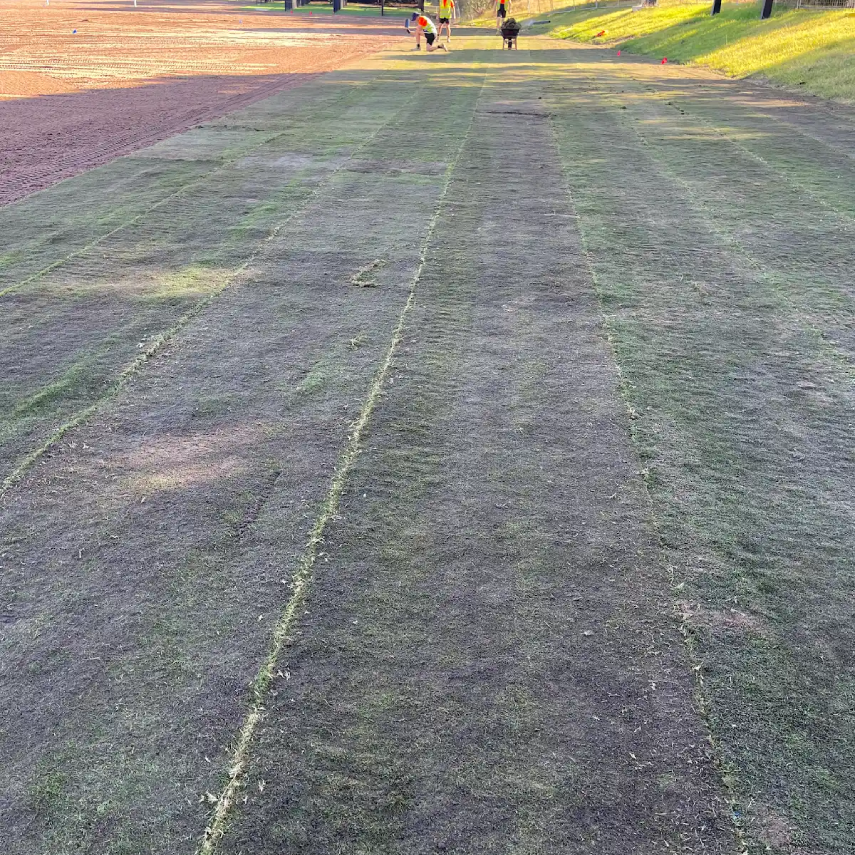 Sports field with visible turf seams and installation pattern.