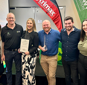 team group photo with award
